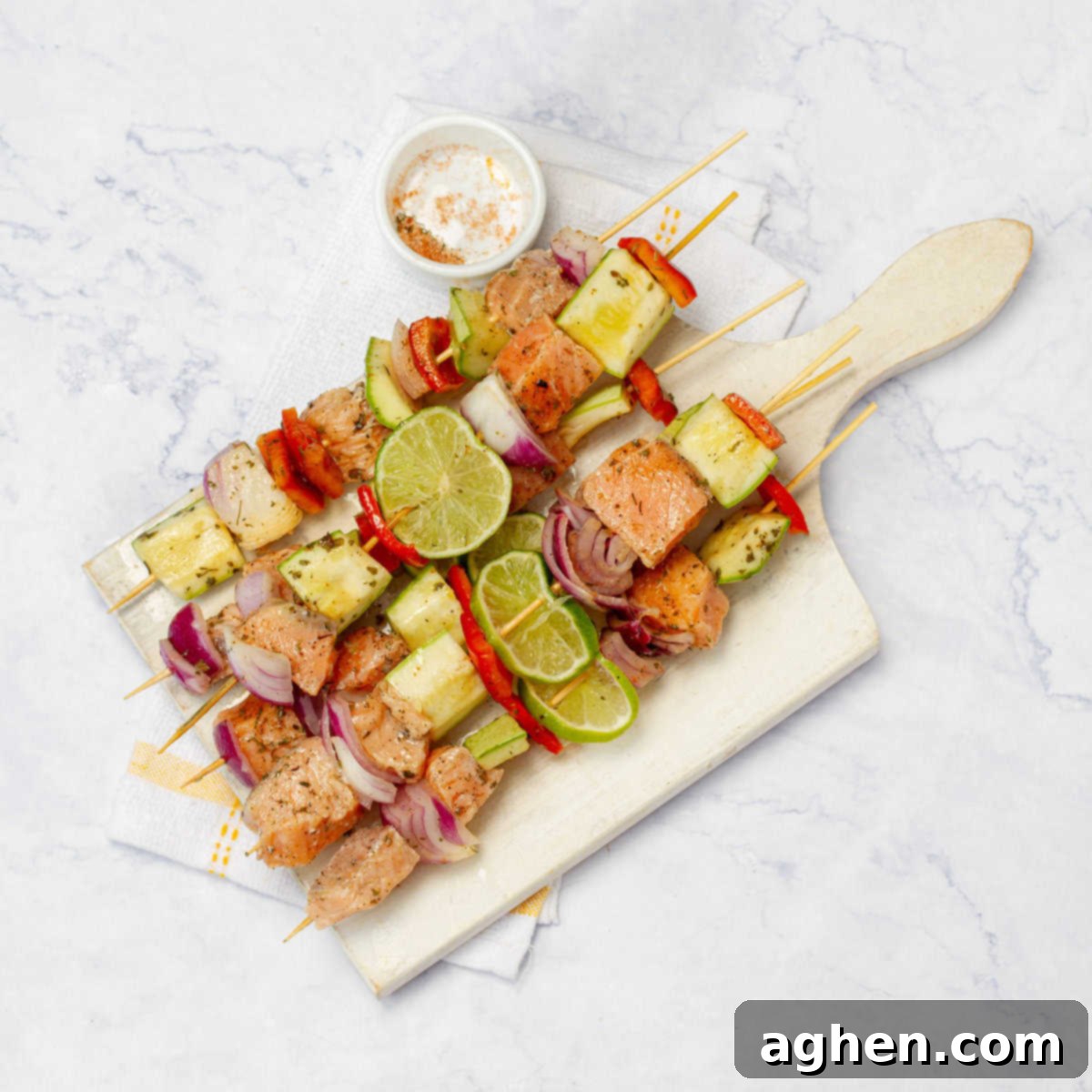 Zesty Herb Salmon Skewers 6 Assembled salmon and vegetable skewers on a board