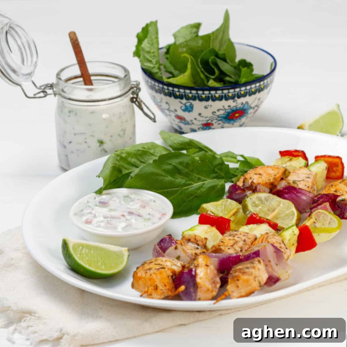 Zesty Herb Salmon Skewers 8 Platter of grilled salmon skewers served with lemons and fresh greens