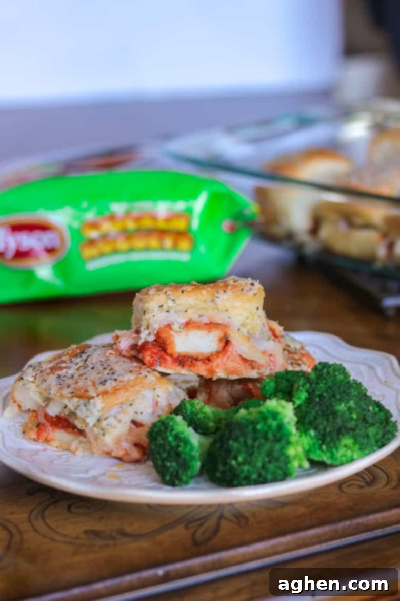 Easy Chicken Parm Sandwiches made with chicken nuggets and served with broccoli.