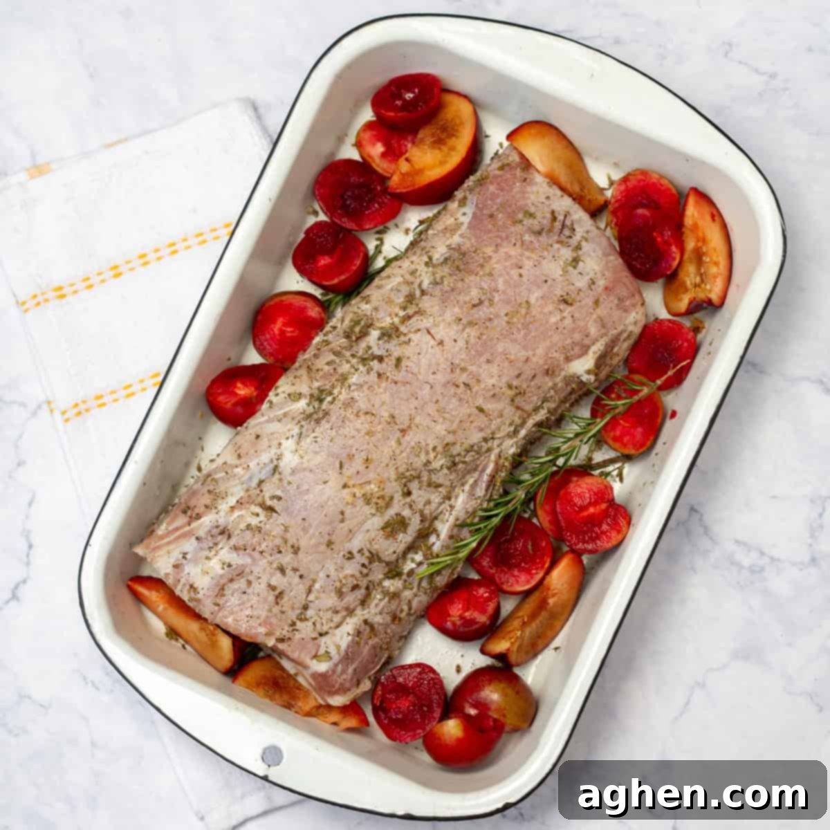 Plum-Glazed Pork Loin 5 Pork loin with plums in baking tray