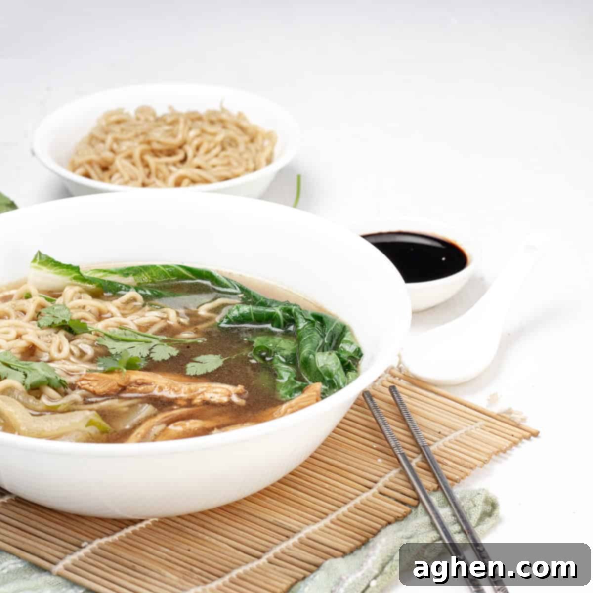 Light & Flavorful Asian Chicken Soup A Modern Take 8 A beautifully presented bowl of Asian Chicken Soup with garnishes