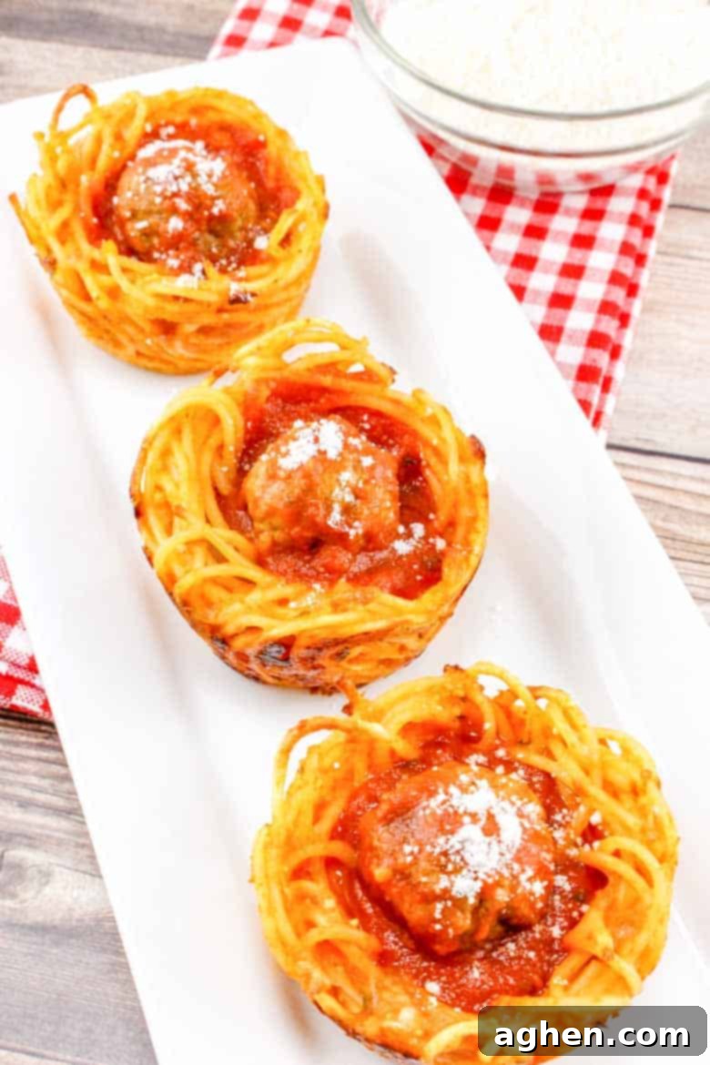 spaghetti and meatball cups on white serving platter, perfect for parties