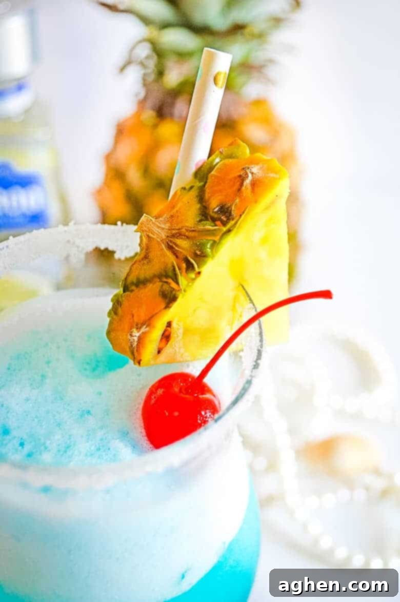 Margarita glass with a sugar and salt rim, garnished with a lime wedge
