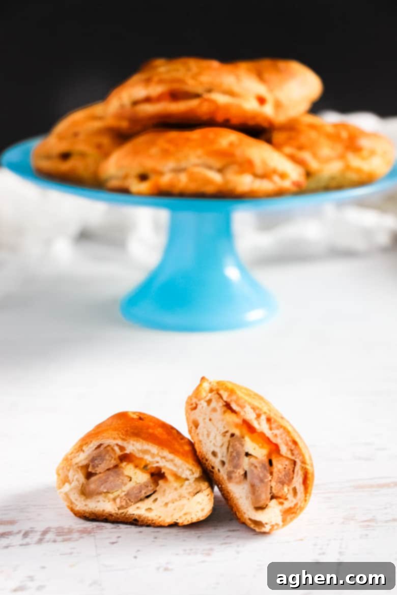 Delicious breakfast calzones made-from-scratch with homemade dough and stuffed with sausage, eggs, and cheese.