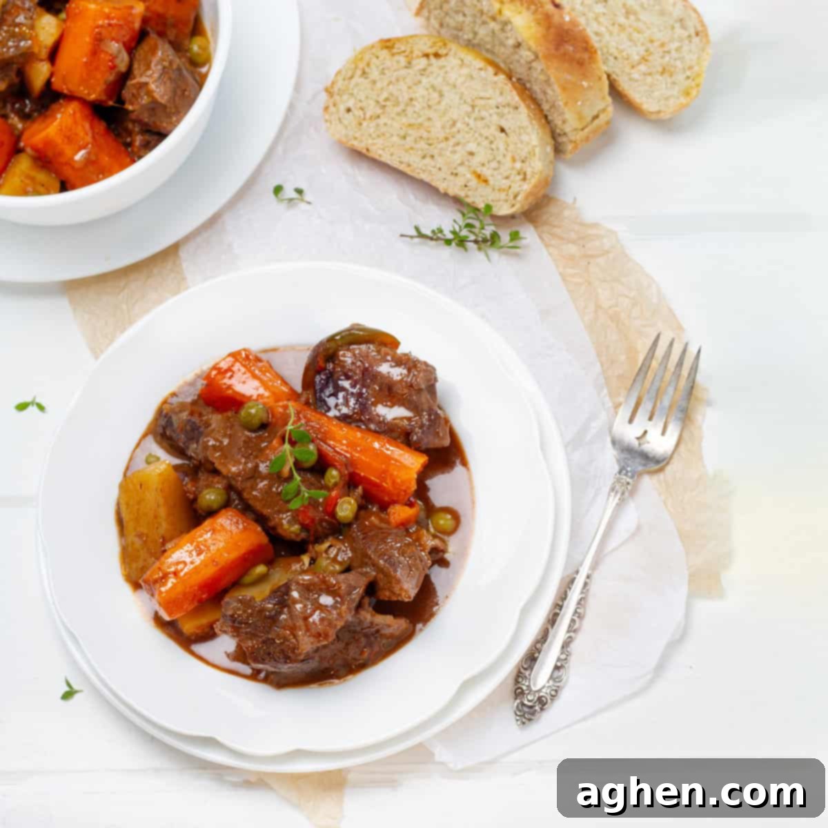 Beef Stew served in a plate with bread
