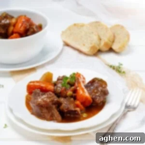 Beef Stew served in a plate with bread