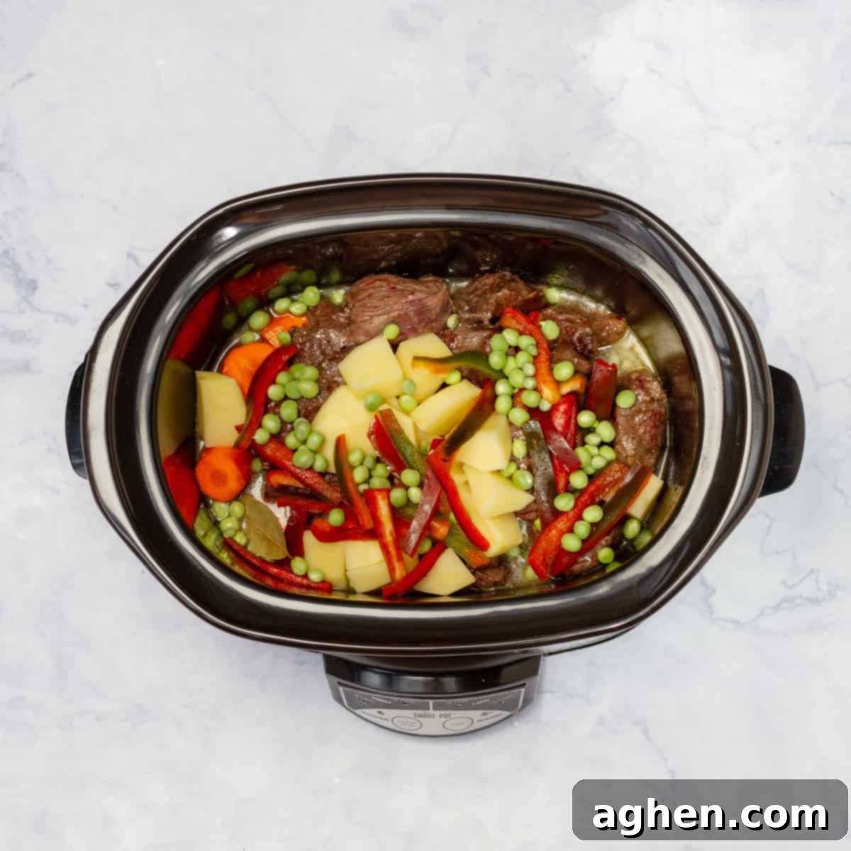 cook beef with vegetables and broth in Crockpot