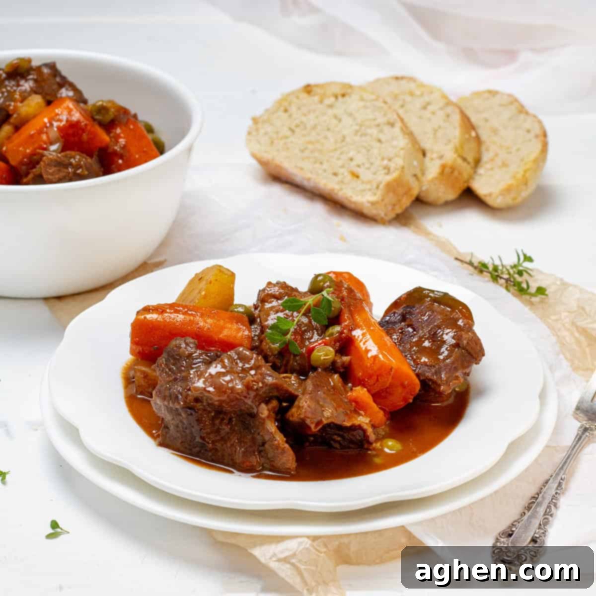 Beef Stew served in a plate with bread