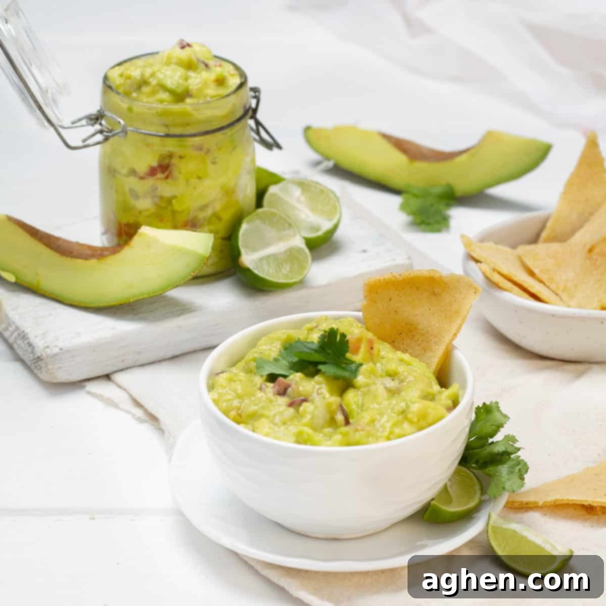 This Must-Try Weight Watchers Guacamole 7 Guacamole served in a bowl with lemon and avocado slices