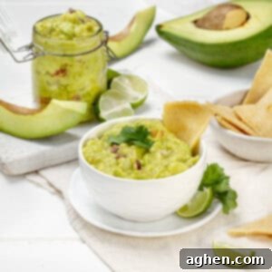 This Must-Try Weight Watchers Guacamole 8 Guacamole served in a bowl with lemon and avocado slices