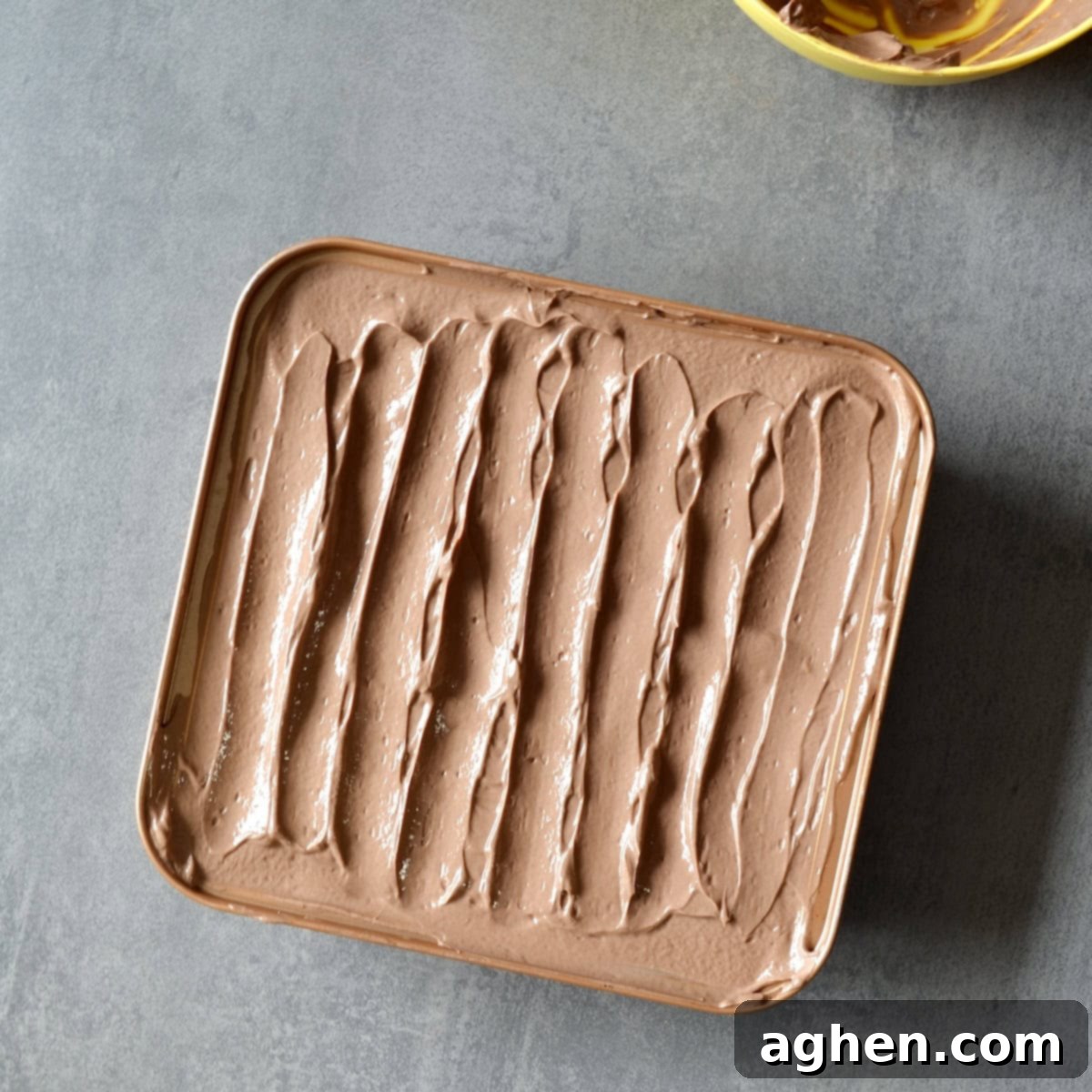 The fully assembled chocolate banana icebox cake, ready for chilling, with a smooth chocolate yogurt top layer