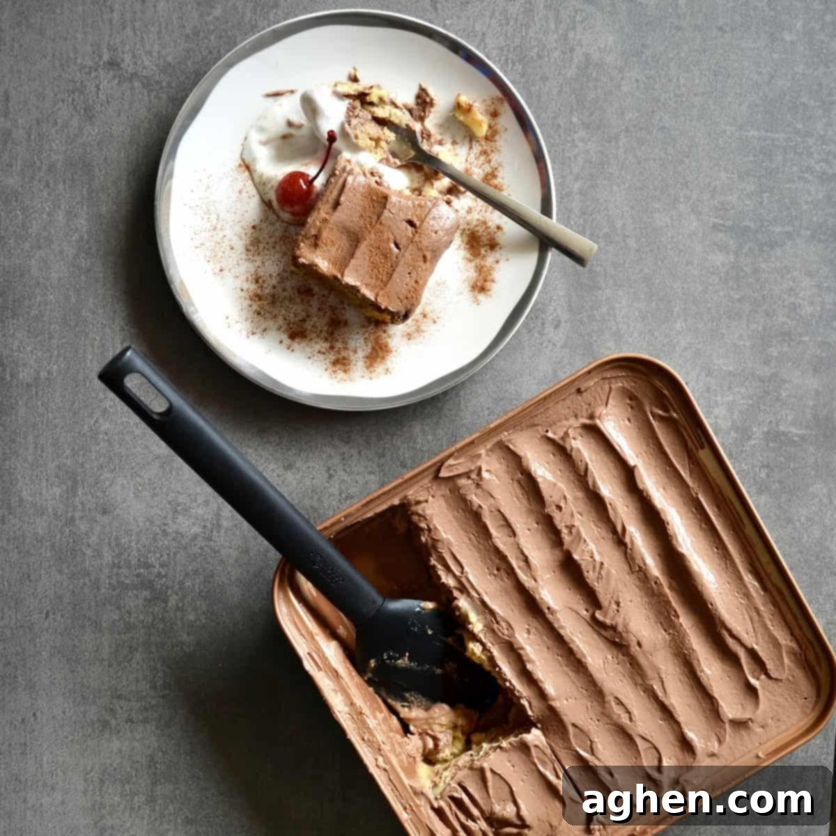 A slice of the chocolate banana icebox cake being served on a white plate, ready to be enjoyed