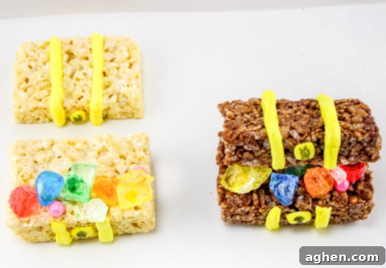 Edible treasure chests made from Rice Krispies treats filled with an assortment of candies like rock candy, pearls, and gold coins.