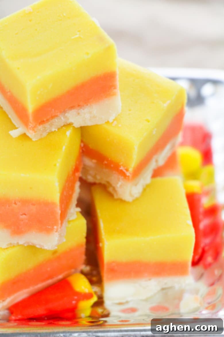 Layered Halloween Fudge Recipe with distinct white, orange, and yellow layers