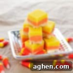 Candy Corn Fudge on silver platter, with candy corn sprinkled around the table