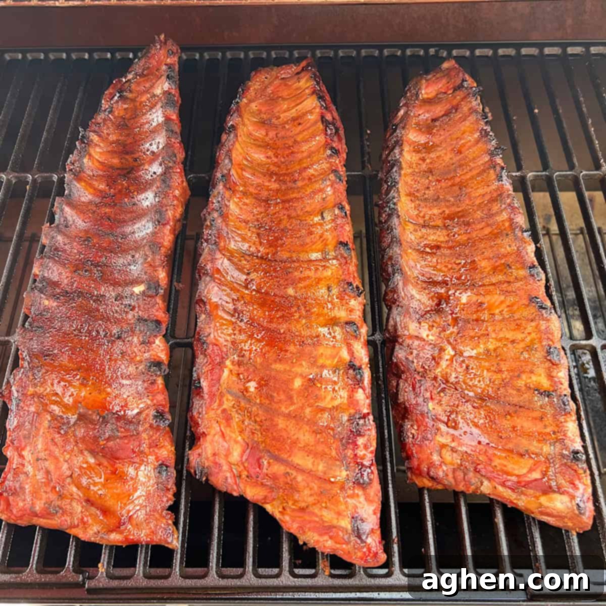 Award Winning Smoked Baby Back Ribs 9 Flipping baby back ribs on an offset smoker for even cooking.