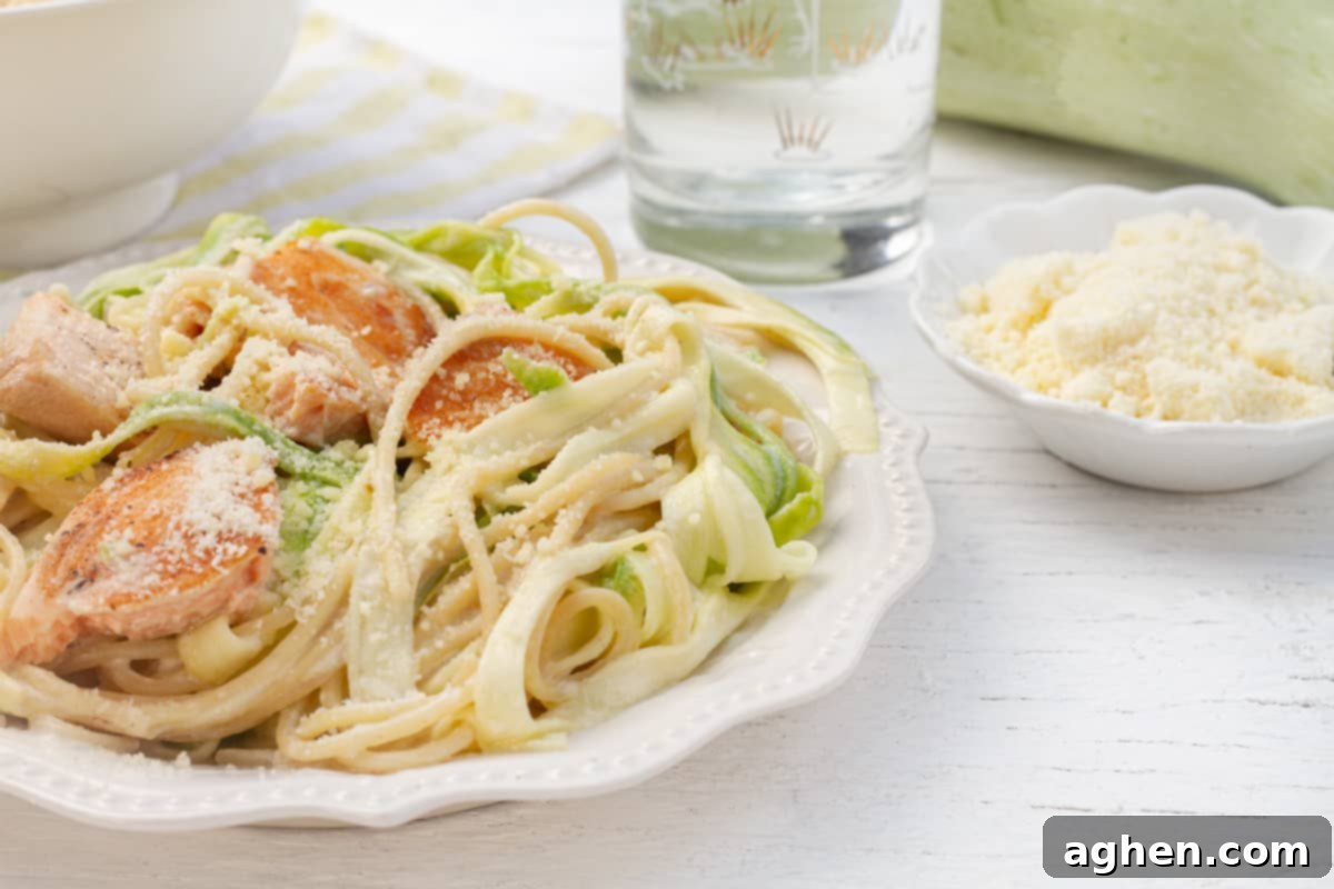 Salmon Alfredo on white plate