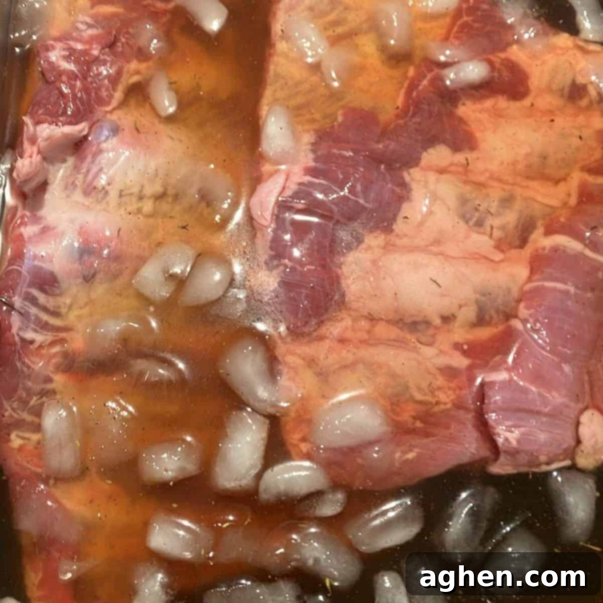 Masterbuilt Smoker Secrets for Irresistible Ribs 4 Pork ribs soaking in brine that's been cooled with ice water.