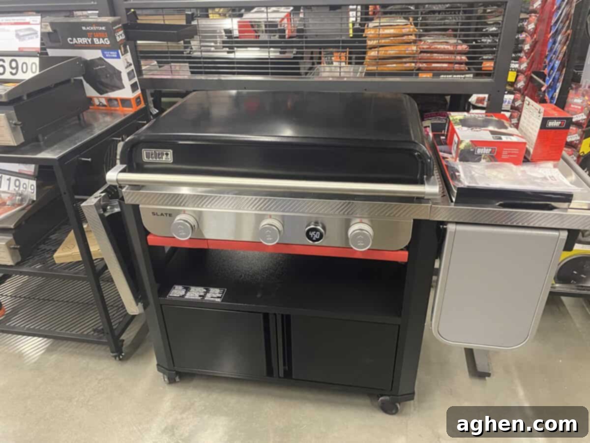 I've Owned Weber Grills Since 1998, And This New One Is A Hard Pass 2 weber griddle on showroom floor