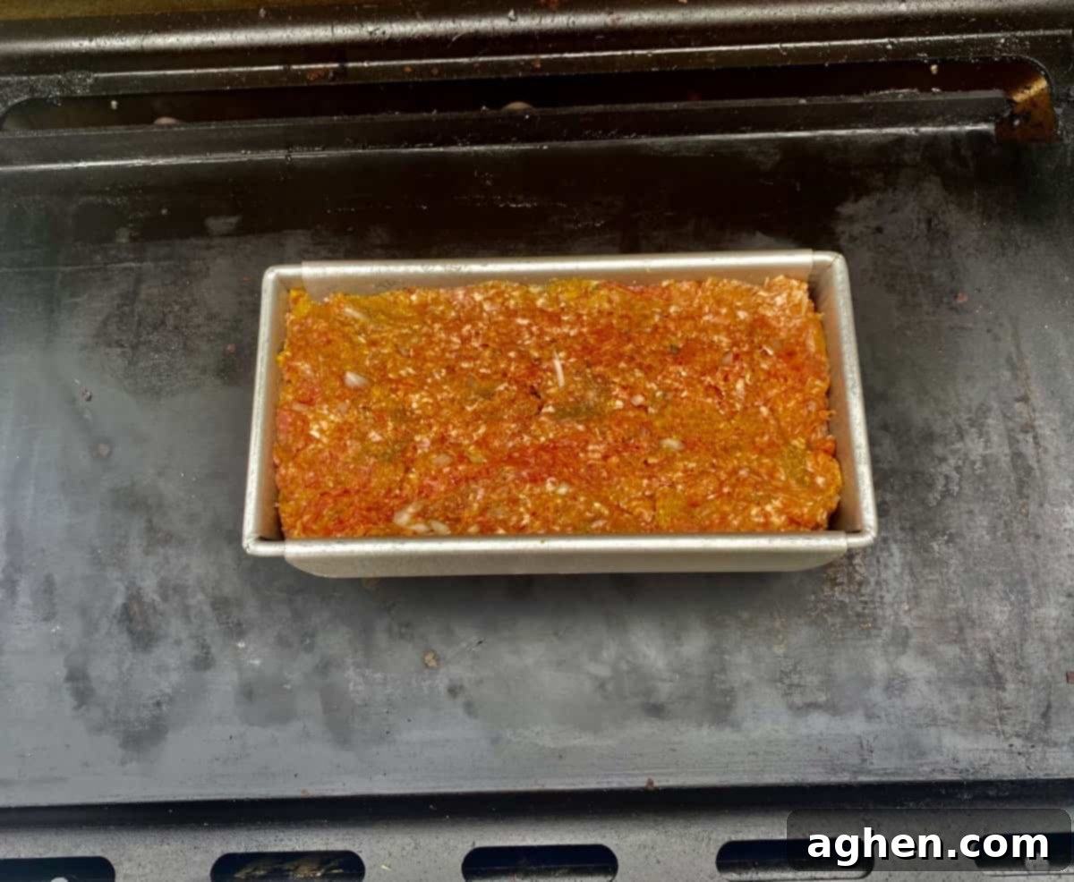 Smoky Rocky Mountain Meatloaf cooking on a Weber grill over indirect heat