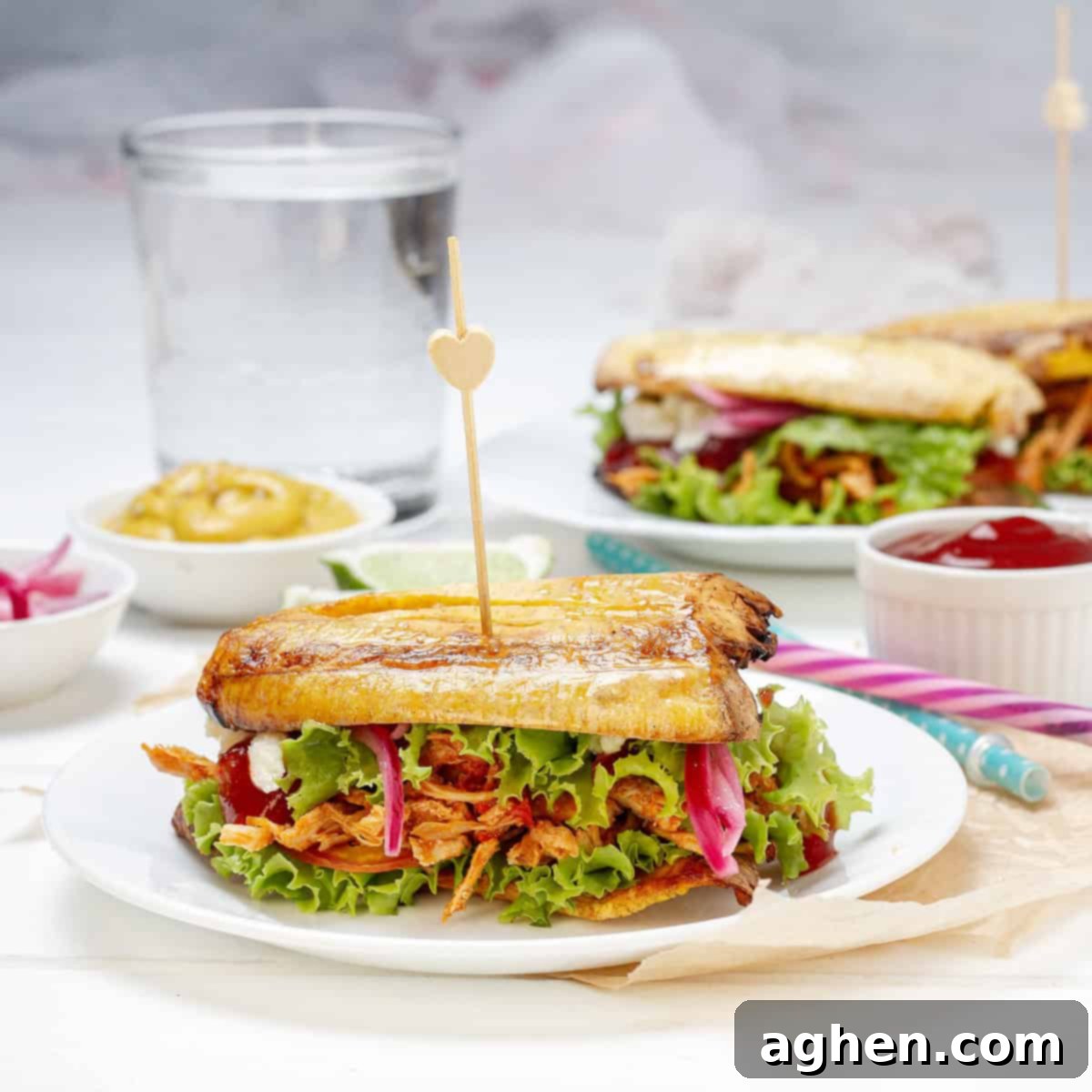 Stuffed Patacones, or fried plantain sandwiches, on a plate.