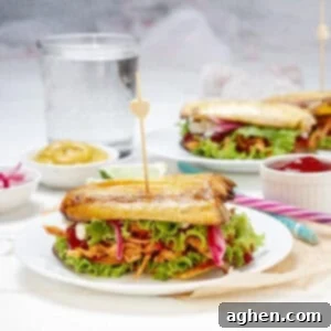 Stuffed Patacones, or fried plantain sandwiches, on a plate.