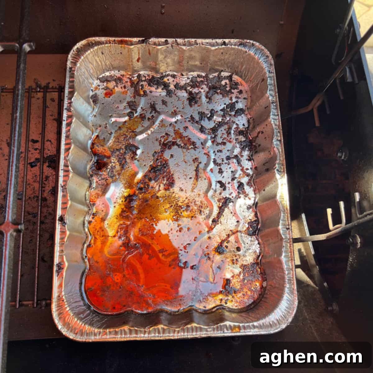 Your First Offset Smoker: Avoid My Biggest Mistakes 4 Disposable aluminum drip pans inside an offset smoker, showing their practical use.