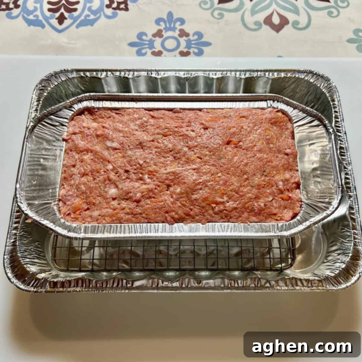 The Cookout's Must-Have Smoked Meatloaf (Recipe Included!) 6 Uncooked meatloaf in a loaf pan, ready for the smoker