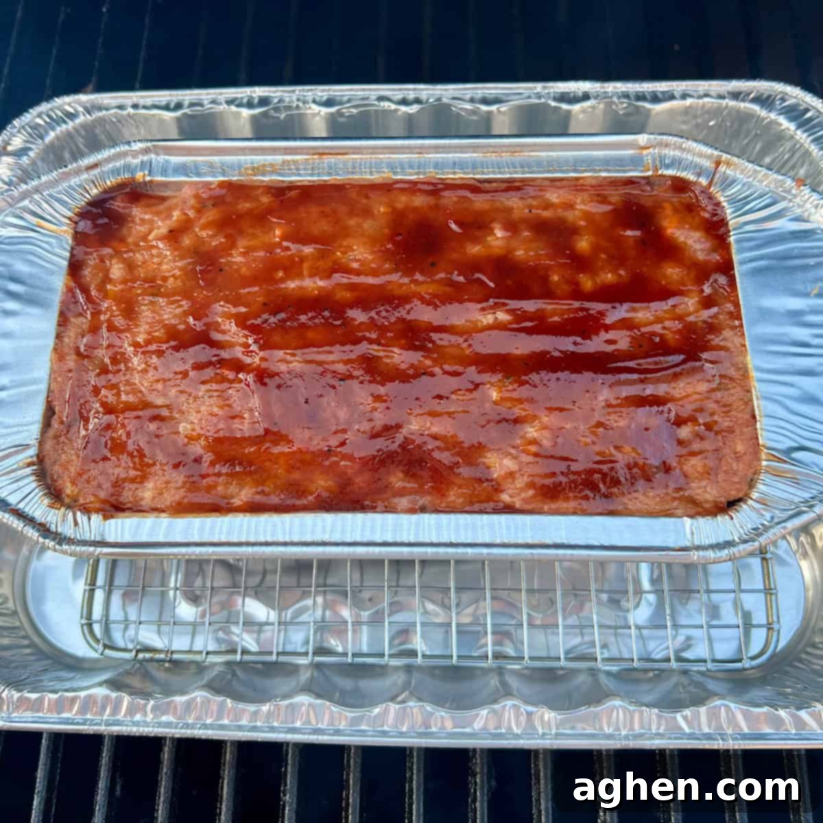 The Cookout's Must-Have Smoked Meatloaf (Recipe Included!) 8 Glazed meatloaf ready for smoking on the grill
