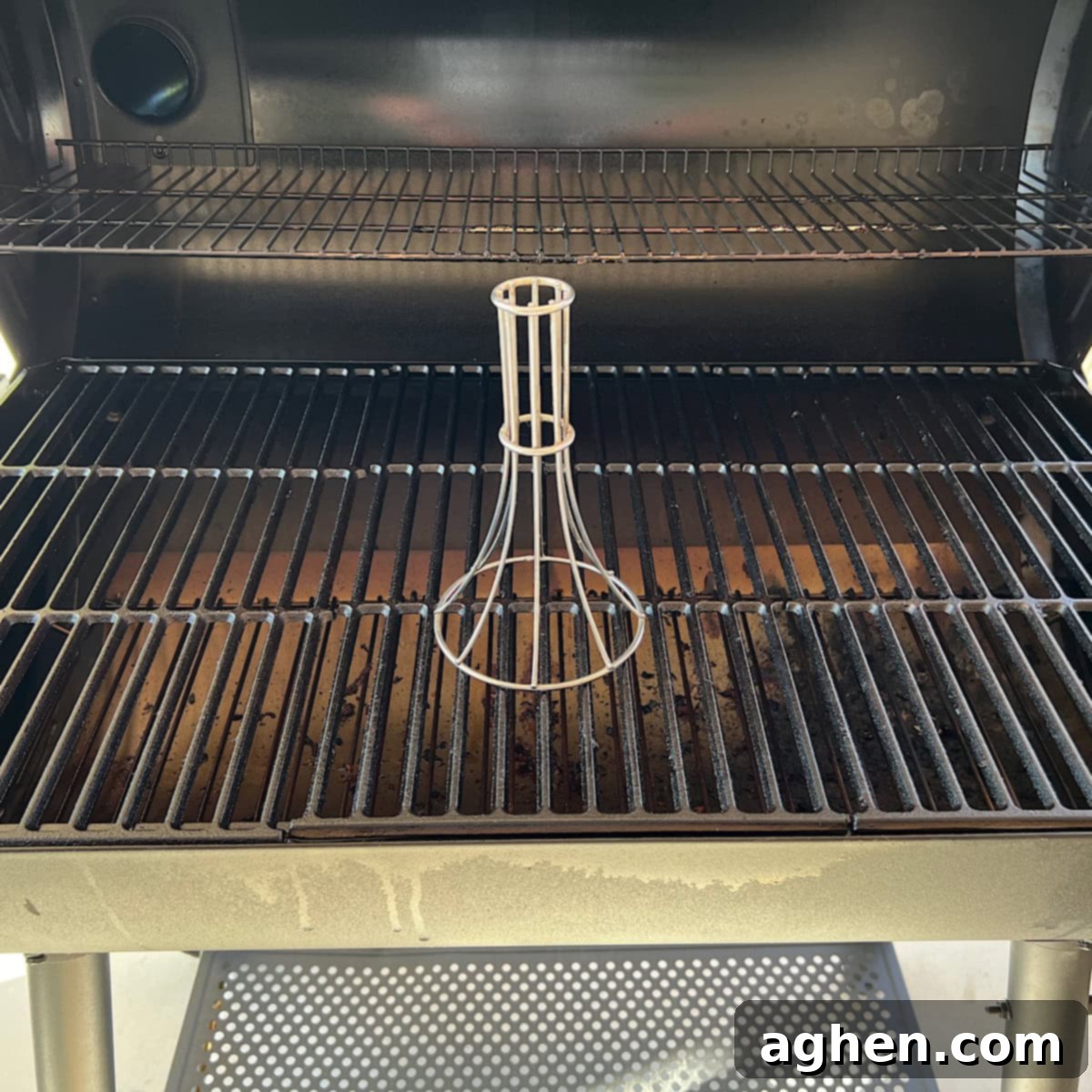 chicken roaster stand sitting on grill 