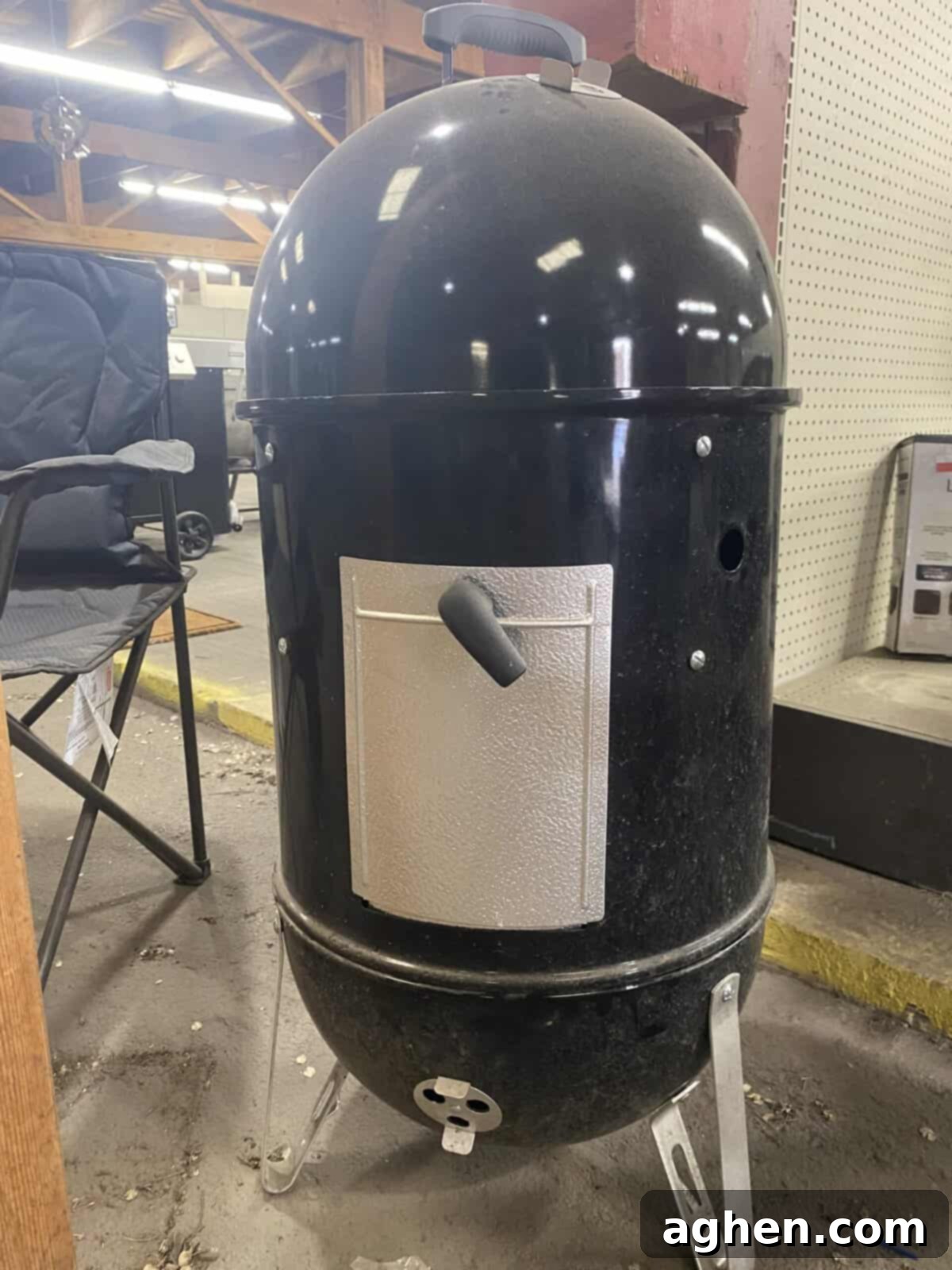 Two Weber Smokey Mountain Smokers side-by-side, comparing the 18-inch and 22-inch models.
