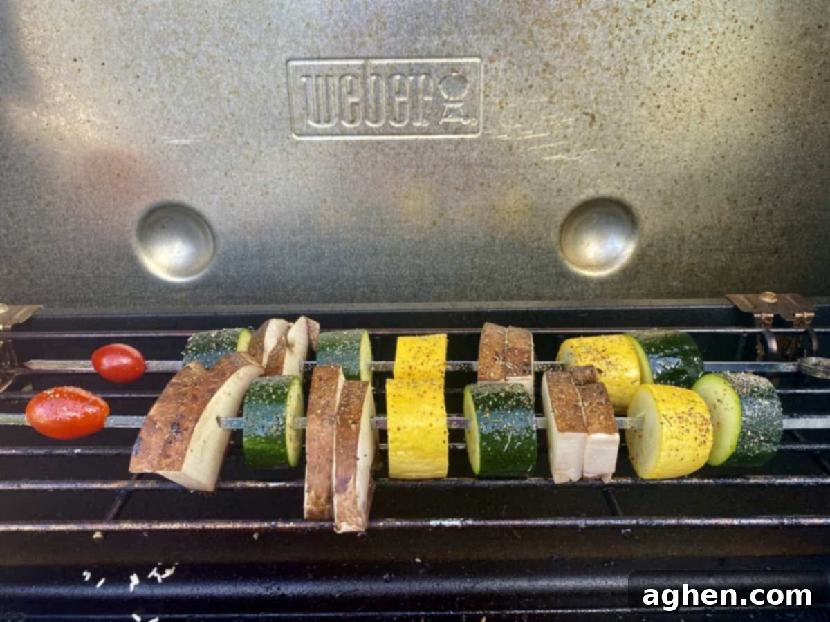 Weber Grills Ideal For Plant Based Diets 2 veggie skewers cooking on grill
