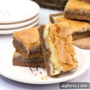 Harvest spice bars with layers of spice cookie, cream cheese, and a flakey crust.