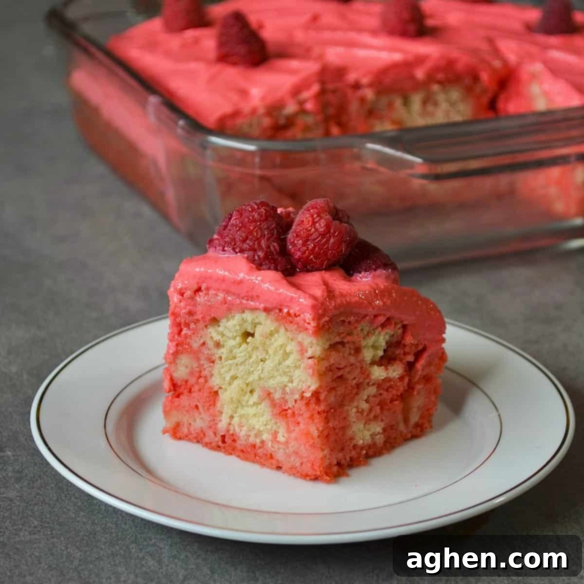 Indulgent Raspberry Poke Cake Weight Watchers Approved 2 Plated raspberry poke cake slice
