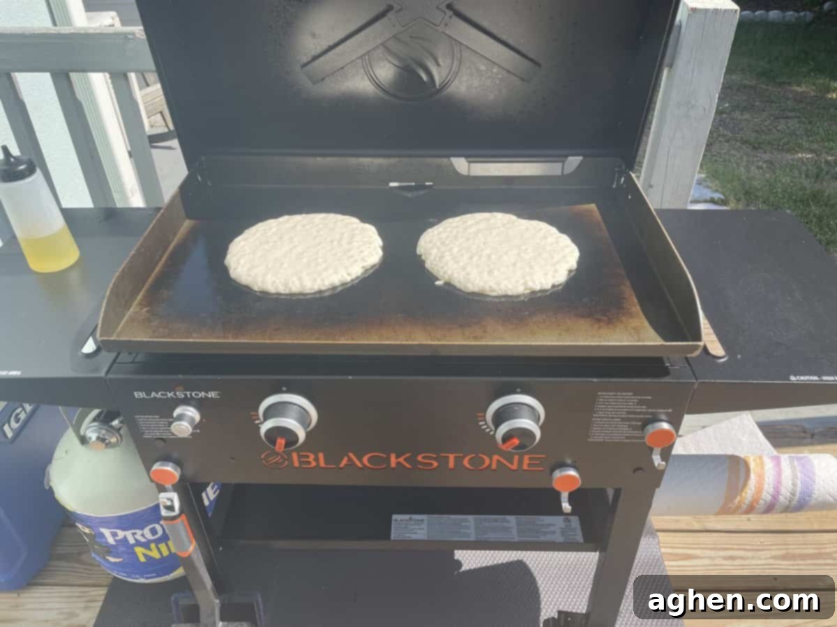 Blackstone's Jumbo Strawberry Pancakes: Every Kid's Dream 16 Close-up of a giant pancake cooking on a Blackstone griddle