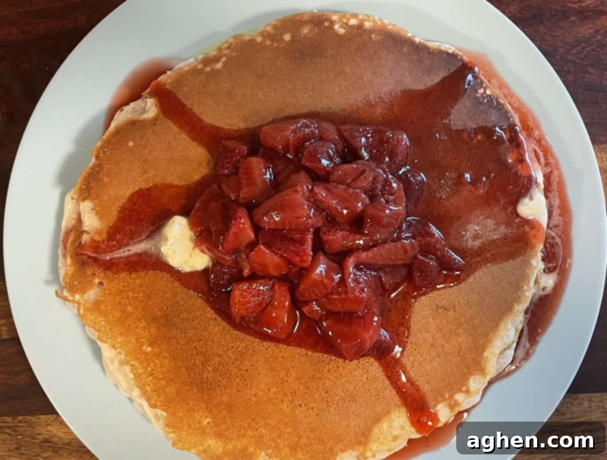 Blackstone's Jumbo Strawberry Pancakes: Every Kid's Dream 5 A large pancake pizza being prepared on a Blackstone griddle