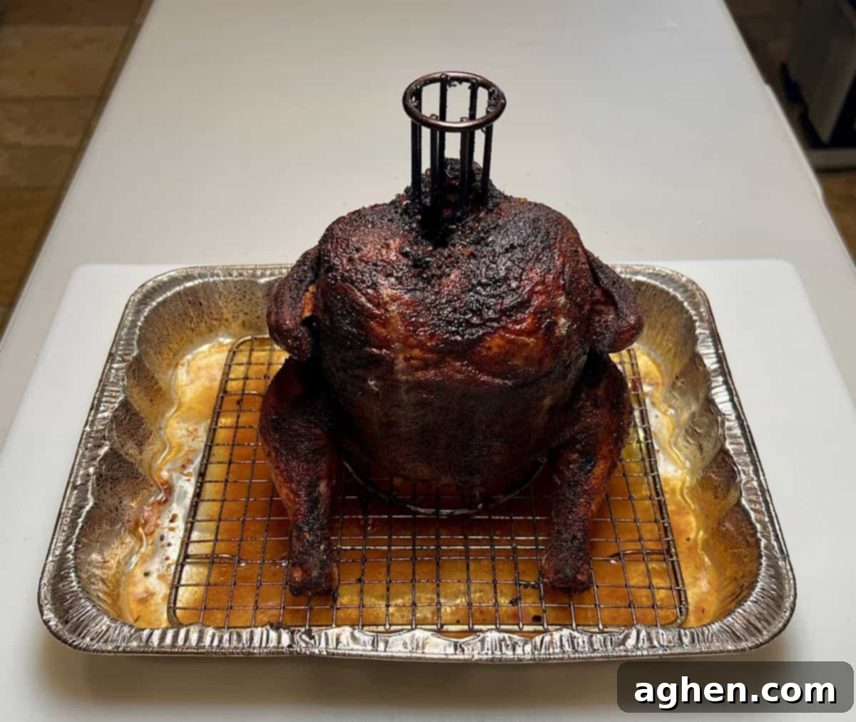 Smoked Standing Chicken No Beer 2 finished smoked chicken in drip pan, golden brown and succulent