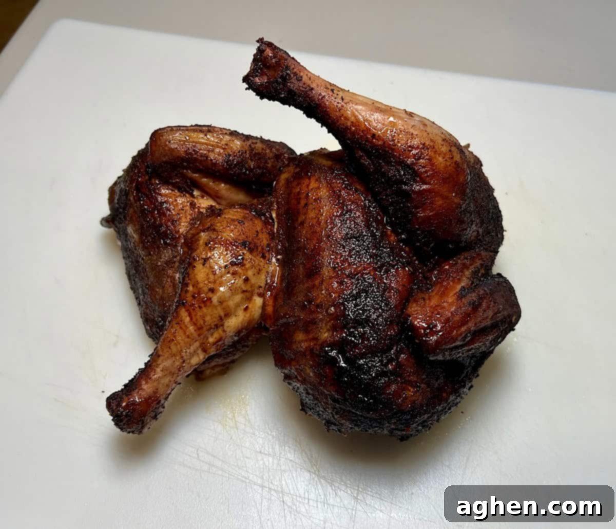 Smoked Standing Chicken No Beer 3 finished smoked chicken cut in half, showing tender, juicy meat
