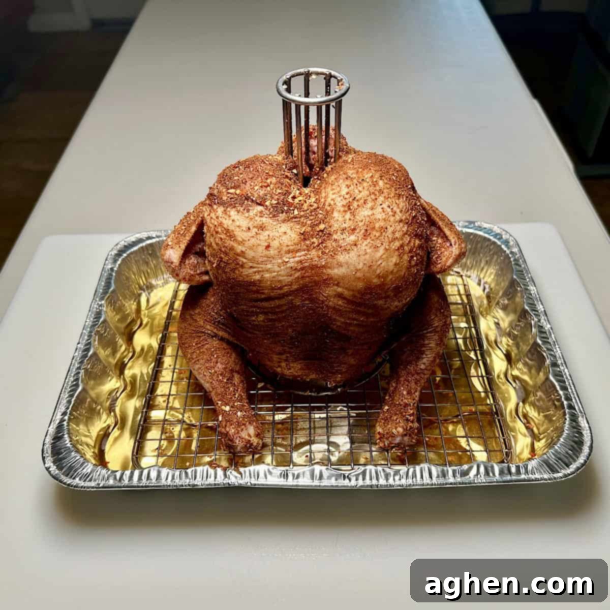 Smoked Standing Chicken No Beer 5 seasoned raw chicken upright on chicken roaster stand