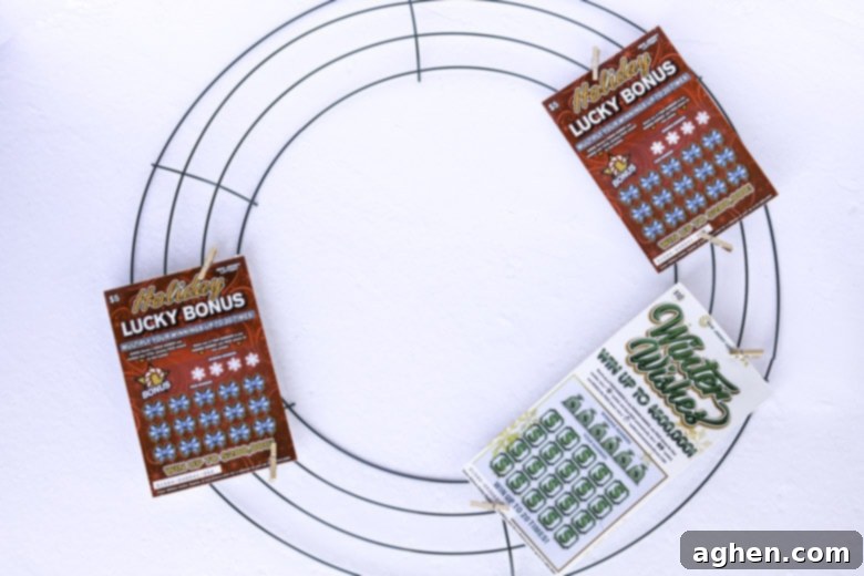 Step-by-step image showing how to make a lottery ticket Christmas wreath, starting with attaching tickets to the form.
