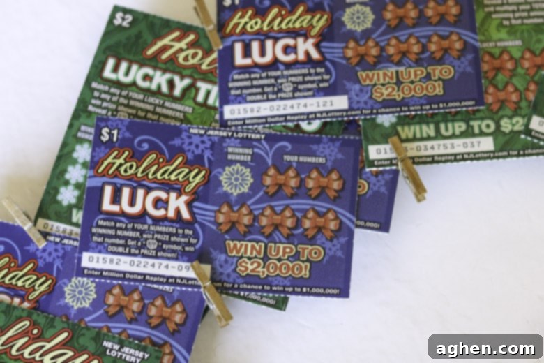 A festive holiday lottery ticket wreath showcasing a variety of tickets clipped onto a metal form, creating a vibrant display.