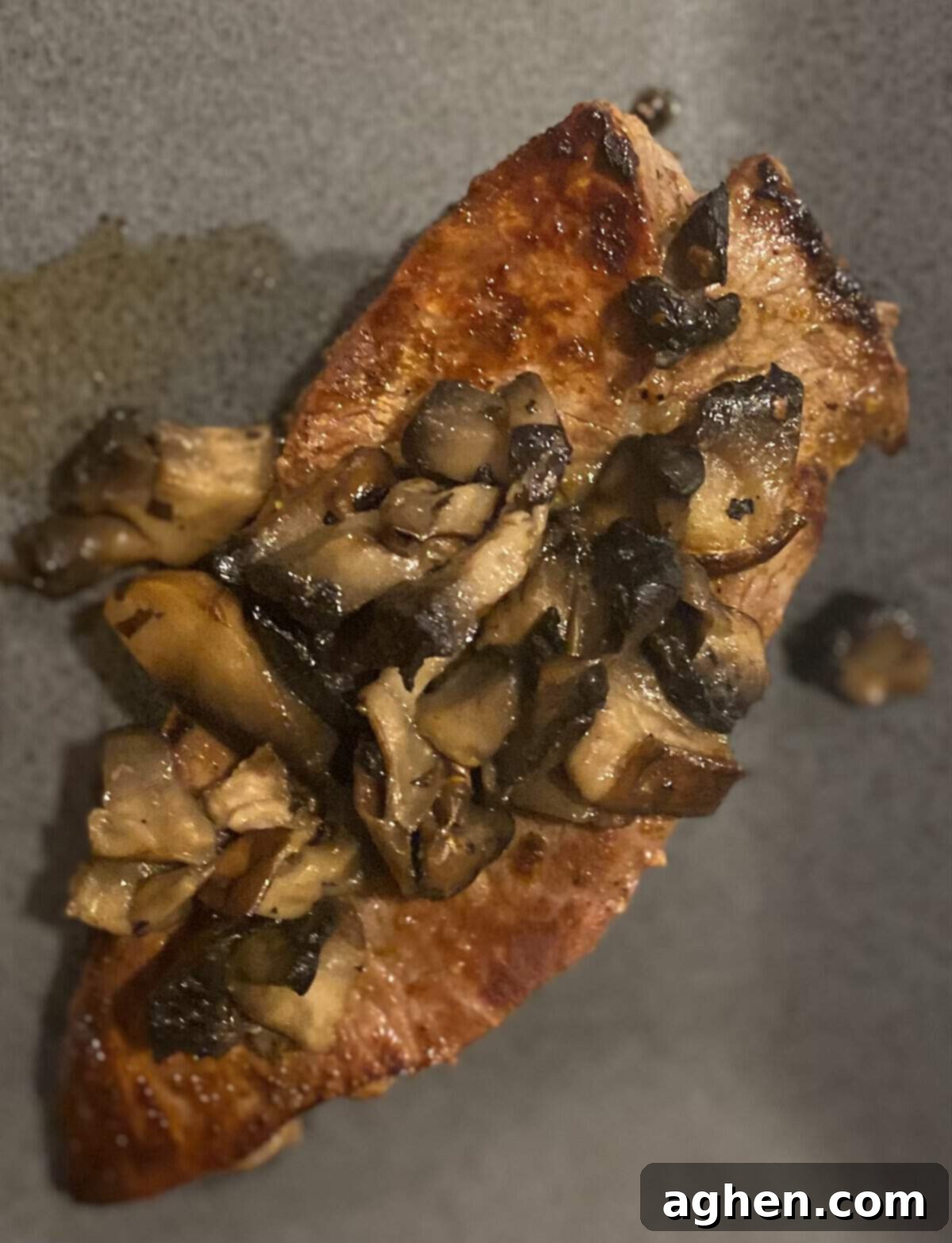 Cooked steak resting on a cutting board