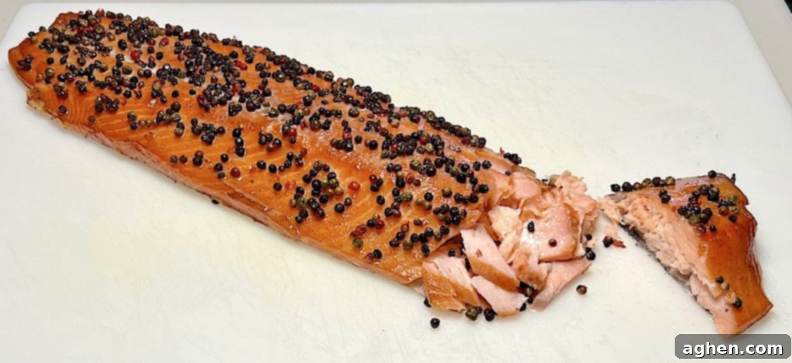 Crafting Perfect Smoked Salmon with Your Offset Smoker 2 Smoked salmon flaked with a vibrant mix of peppercorns
