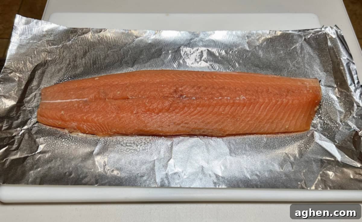 Crafting Perfect Smoked Salmon with Your Offset Smoker 7 Salmon on foil after brining, ready for honey and peppercorns