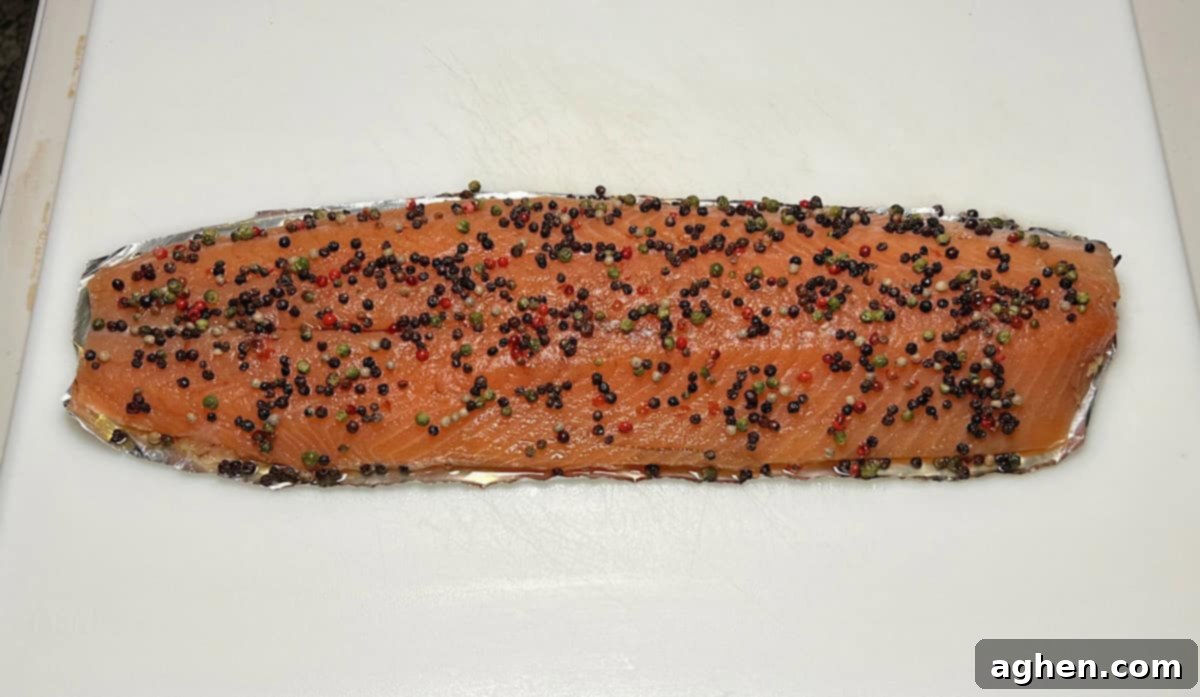 Crafting Perfect Smoked Salmon with Your Offset Smoker 9 Salmon fully coated with honey and peppercorns, ready for the smoker