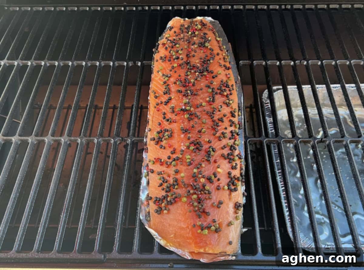 Crafting Perfect Smoked Salmon with Your Offset Smoker 10 Salmon cooking on the grill grate of an offset smoker