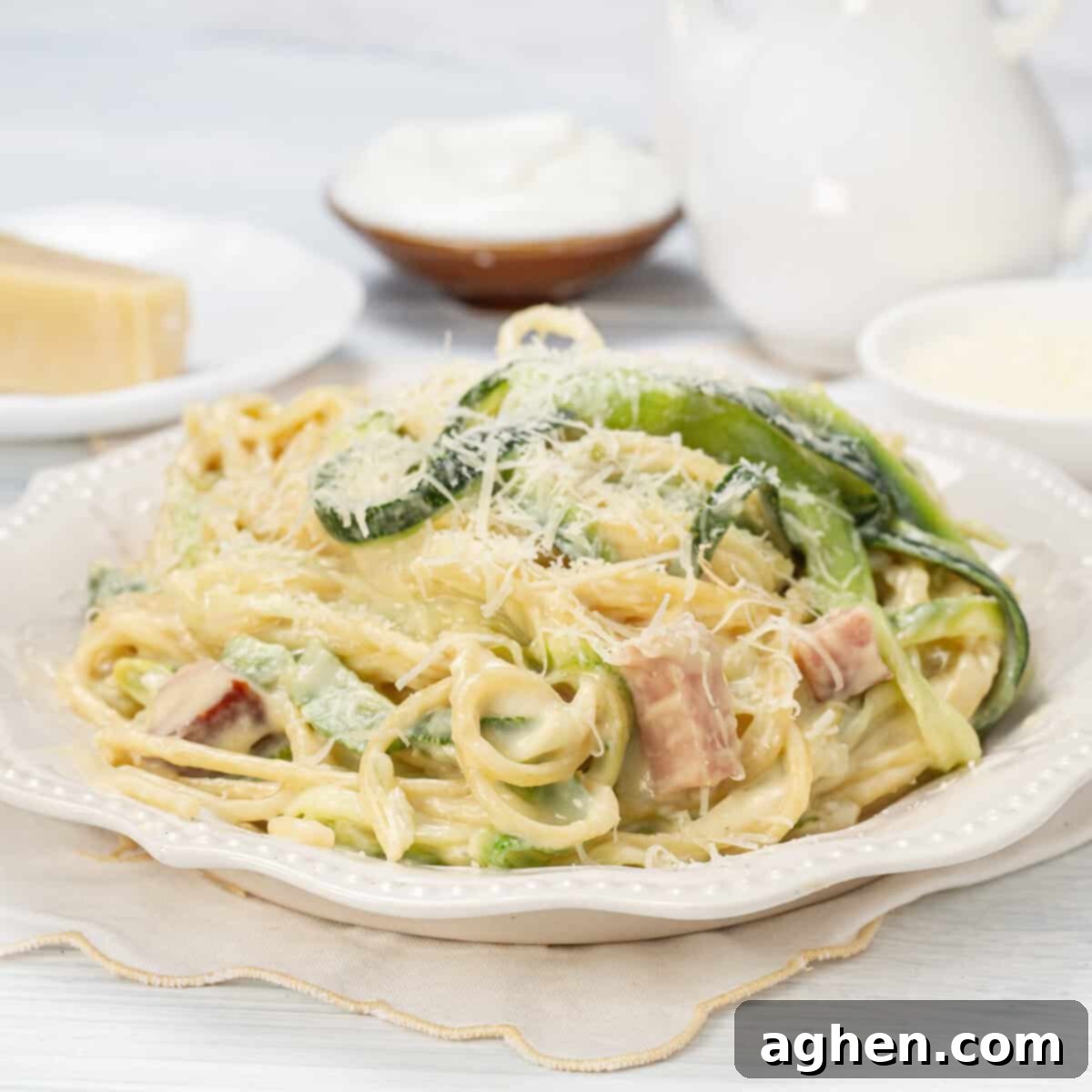 Creamy Weight Watchers-friendly Light Carbonara on a dish, garnished with fresh herbs.