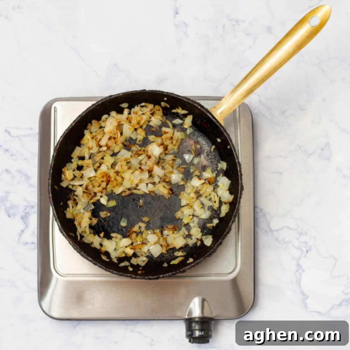 GuiltFree Classic Shakshuka for Weight Watchers 4 Onions browning in a pan.