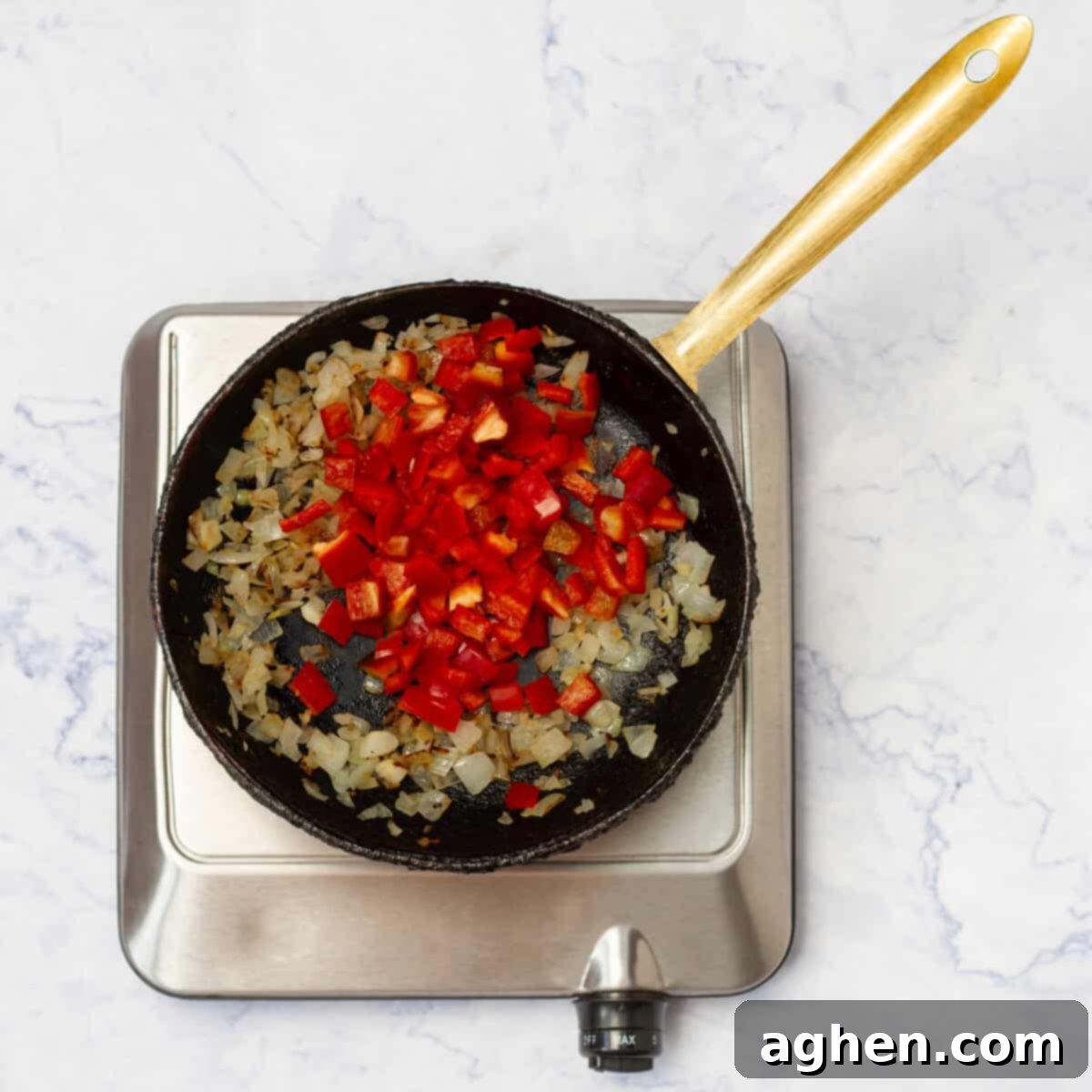 GuiltFree Classic Shakshuka for Weight Watchers 5 Peppers added in with the onions browning in a pan.