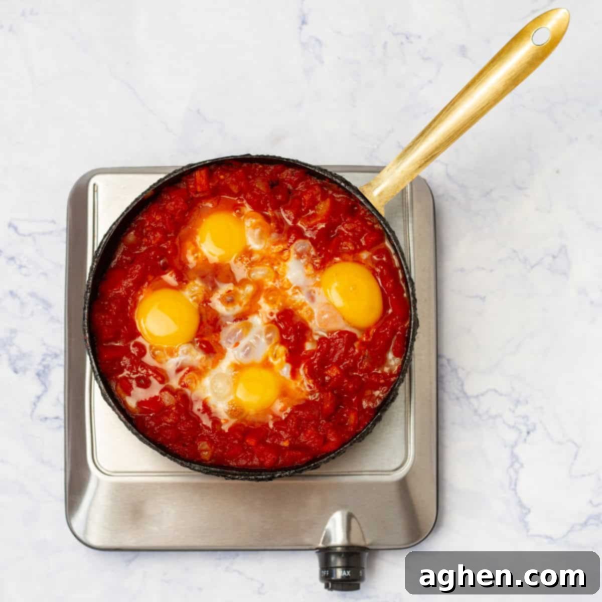 GuiltFree Classic Shakshuka for Weight Watchers 7 Eggs cooking in the sauce.